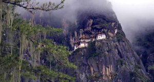 A building in Bhutan, set on the edge of a mountain.