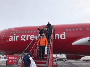 People alighting an Air Greenland plane.