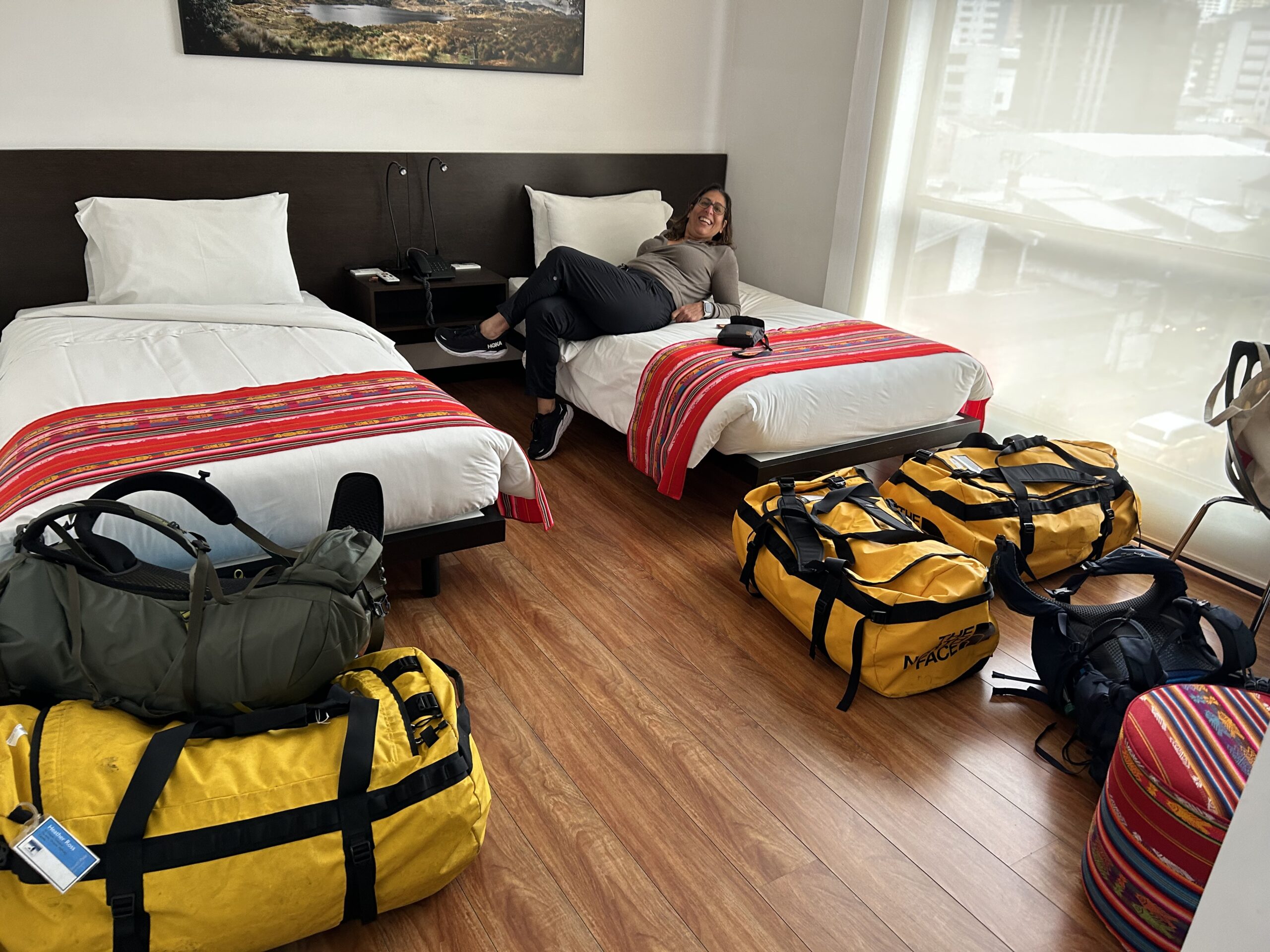 Interior of the hotel room, filled with hiking equipment