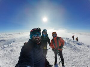 The Test Your Limits team hiking in the clouds on Mount Chimbozaro.